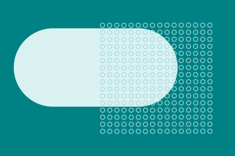Pill shape and dot pattern on teal background